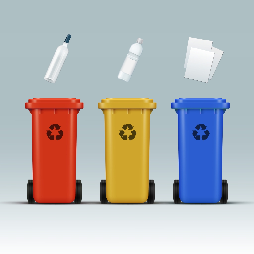 Mülltrennung in mülltonnen nach dem prinzip des zweikammersystems: gelbe tonne und verpackungsmaterial getrennt.